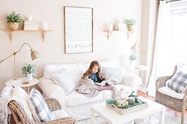 Girl studying on sofa